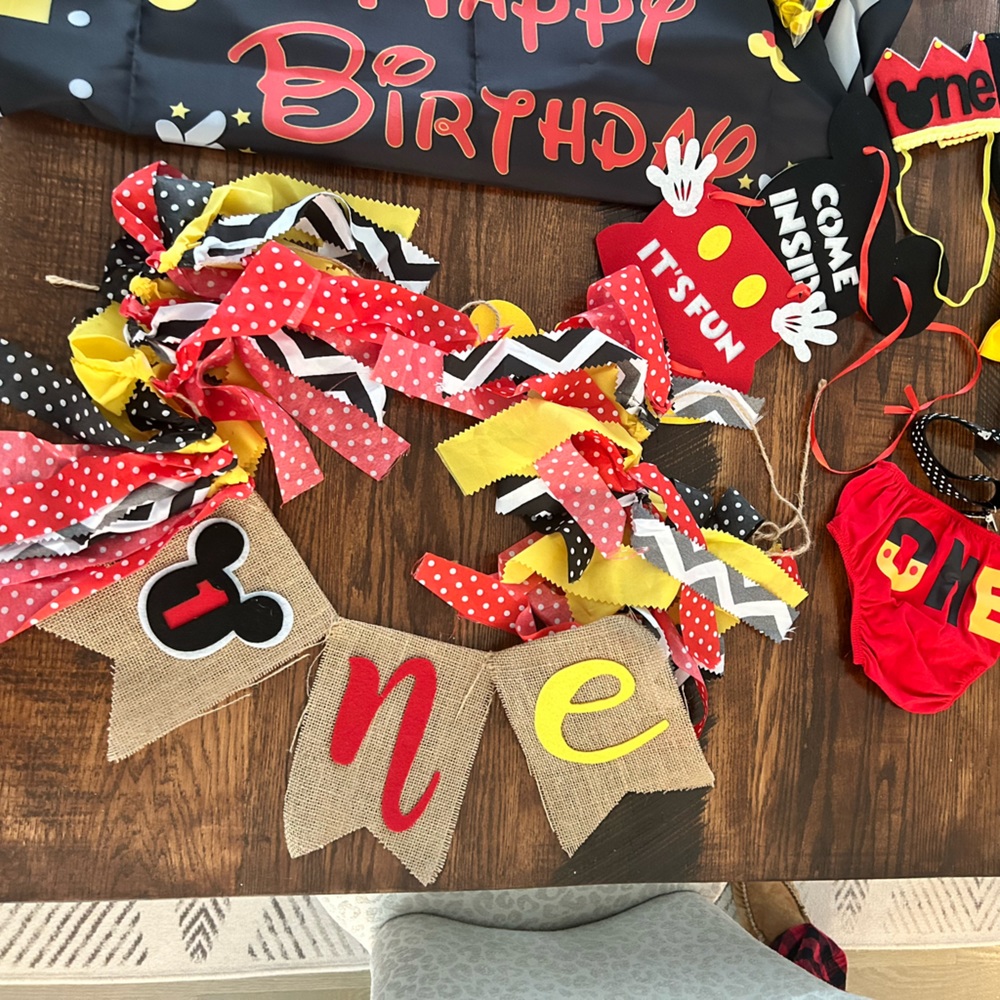 Mickey Mouse 1st birthday decorations and outfit.